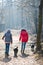 Back view of two teen girls walking with a dogs - Cold morning t