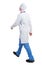 Back view of walking doctor in a robe hurrying to help the patient.