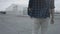 Back view of a walking guy wearing a plaid shirt and jeans. Walking in an epic manner, walking confident. Turning from