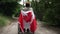 Back view wide shot wheelchair with Canadian flag and African American young man thinking admiring nature