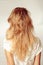 Back view of woman with beautiful long blonde hair