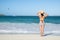 Back View of a Woman in Polka Dot Bikini Standing on a Beach 1