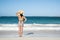 Back View of a Woman in Polka Dot Bikini Standing on a Beach 2