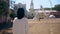 Back view of a woman walking through the fairground