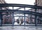 Back view of woman wearing long coat standing on bridge in old warehouse district Speicherstadt in Hamburg