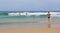 Back view of women at the beautiful scenery of beach