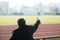 Back View of Young Excited Man on Bleachers