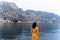 Back view of a young female admiring view of the Kotor Bay