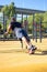 Back view of young man with prosthetic leg doing push-ups