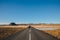 back view of young woman walking in asphalt road in iceland, reykjanes