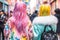Back view of young women with bright colorful hair and clothes. Japanese Harajuku street fashion style. Generative AI