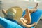 Back view of young women healthy body wearing white bikini and straw hat lifestyles relaxing near swimming pool sunbath, in the su