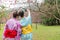 Back views of ladies hands under the cherry tree