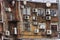 Back wall of a brick building with hanging air conditioners.