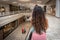 Back of woman with long brown hair at mall