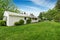 Back yard of American rambler with green grass and lots of space