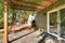 Back yard with pergola , tile floor and wooden walkout deck