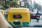 The back of yellow and green taxi meter on the street in Kolkata, India.