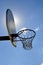 Backboard blocks sun in outdoor basketball