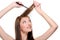 Backcombing long brunette female hair