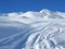 Backcountry ski tracks in deep powder snow in winter in the Swiss Alps