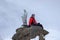 Backcountry skier and mountain climber on the summit of Corno Nero in the Alps of Italy on a winter day