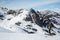 Backcountry skier scouting lines on remote Alaskan peaks in the wilderness