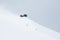 Backcountry skier turning through deep powder snow of Hokkaido Japan