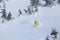 the backcountry snowboarder elegantly carves through the pristine, untouched powder snow