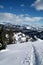 Backcountry uphill ski tracks with blue sky