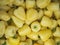 Backdrop of stacked yellow peppers