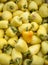 Backdrop of stacked yellow peppers