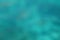 Background abstract blurry turquoise water surface of the sea