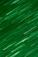 Background abstract dynamic green neon light and stripes moving fast