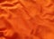 Background abstract surface texture of wavy orange fabric