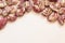 Background arch of red speckled October beans on white, creative copy space