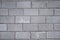 Background of asphalt gray rectangular tiles.