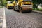 Background of asphalt roller that stack and press hot asphalt. Road repair machine