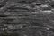 Background on the basis of the texture of rock. Horizontally layered, black with white veins