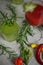 Background with beverages - colorful coctails, chilli pepper and rosemay top view closeup