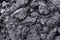 Background from black soil. Textured surface. Soil consists of a