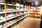 Background blur of wine shelf rack at retail store
