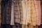 Background Blurred Defocused A row of vintage coats made of animal fur.
