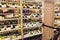 Background Blurred Defocused of wine shelf. Bottles lay over straw. Wine cellar. Defocused Blurry
