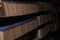 Background with bookshelves of the library archive room. Rows of old books. The concept of historical studies back to school and