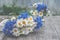 Background of bouquets of beautiful wild flowers of daisies and cornflowers on the background of the old wooden background. Copy