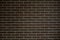 Background of a brick dark wall, tile texture with a smooth pattern.