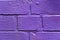 Background: Bricks spray-painted purple