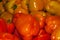 Background - bright orange and yellow fruits of capsicum bell pepper