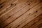 Background of brown boards laid diagonally close-up, brown board background and vignette. Wooden background